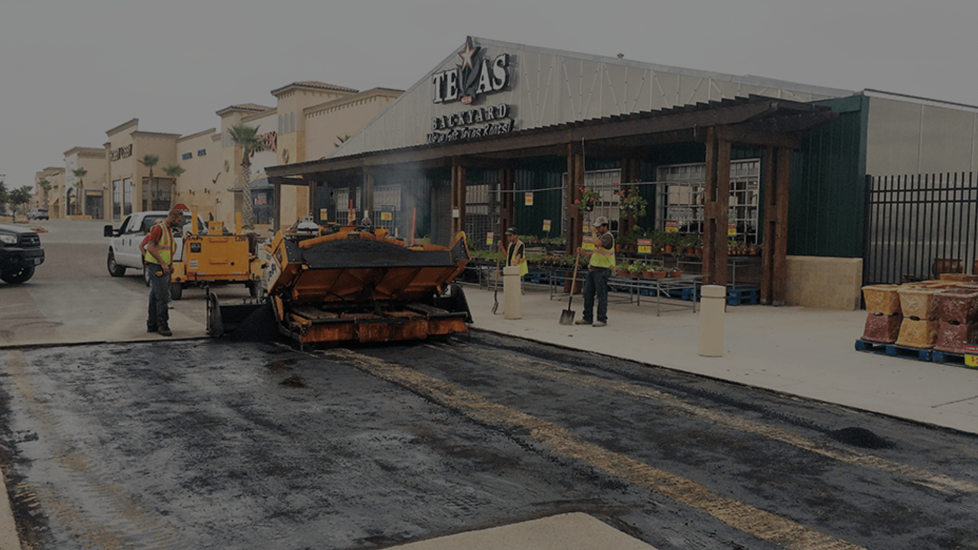 Shopping center parking lot paving in progress